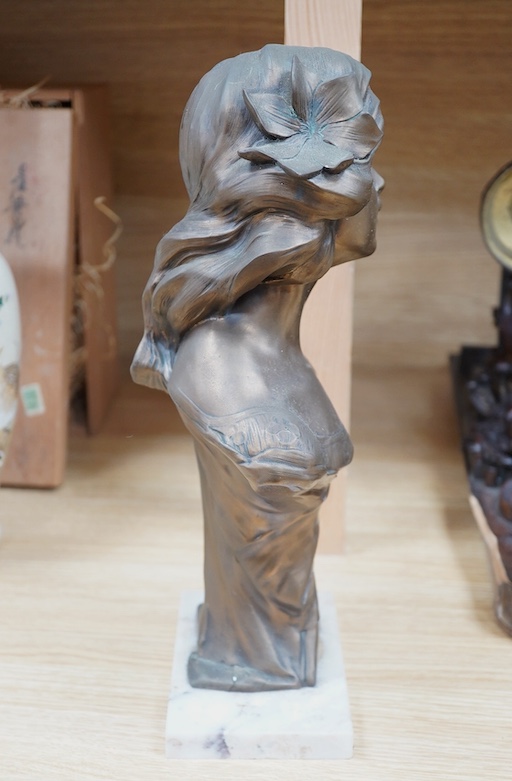 An Art Nouveau style bronzed bust of a lady on marble base, 34cm. Condition - fair